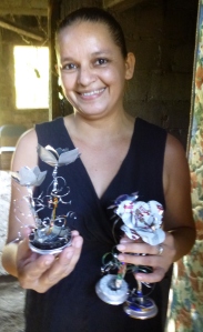 Filena makes these decorative flowers out of recycled aluminum cans to then sell for a profit. 