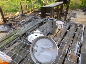 A dish rack and scraps of wood and metal sheeting was all that was left of her home when we returned to the scene three weeks later. 